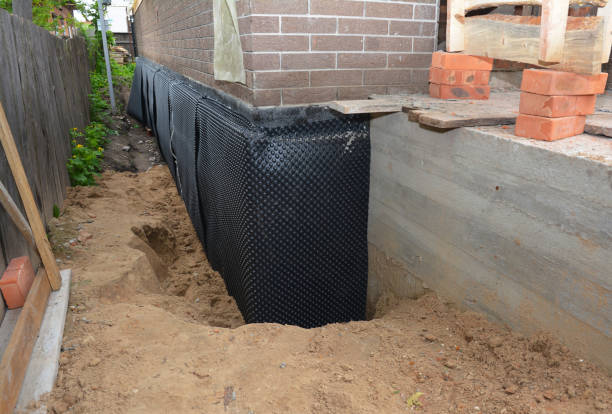 Happy homeowners after waterproofing job in Juneau
